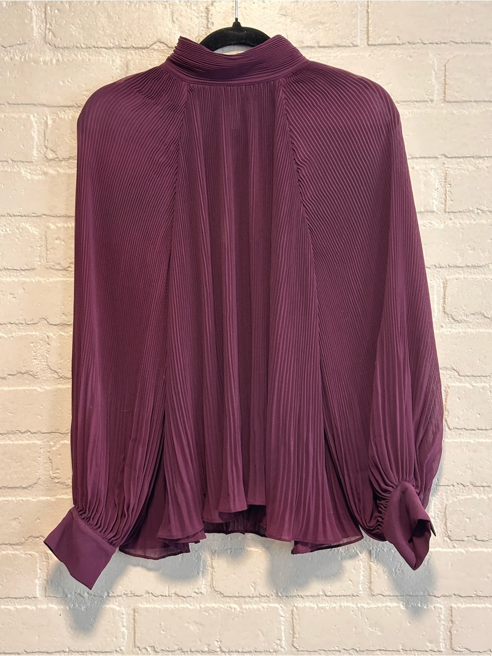 Banana republic dark purple pleated blouse with mock neck and long sleeves.